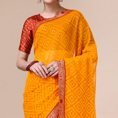 Bright Orange Bandhani Foil Printed Chiffon Saree With Tassels