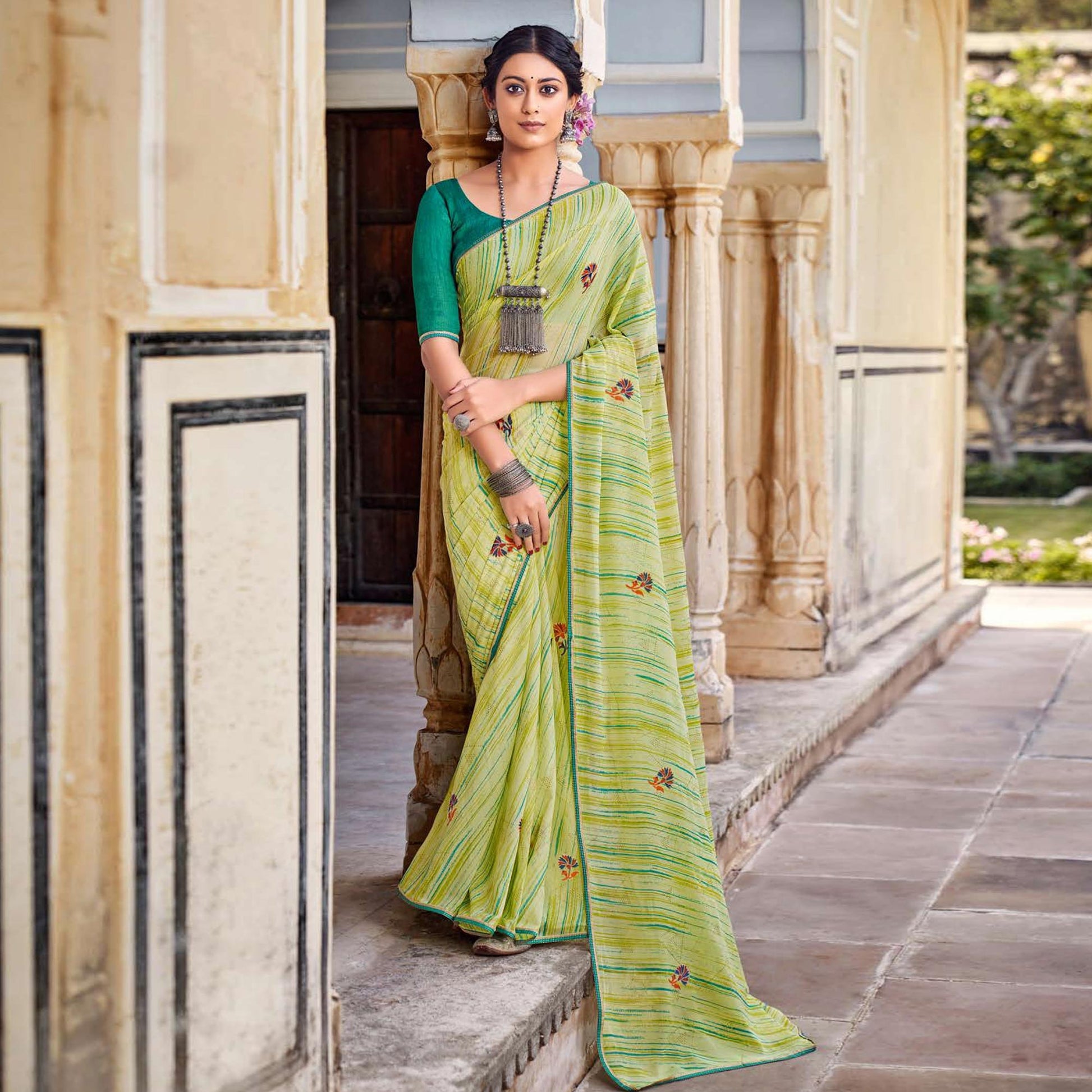 a-green-printed-raw-silk-saree-with-fancy-border