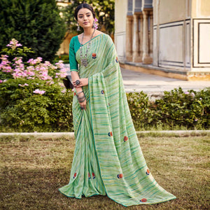 green-printed-raw-silk-saree-with-fancy-border