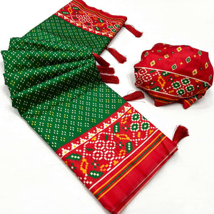 green-patola-printed-tussar-silk-saree-with-tassels