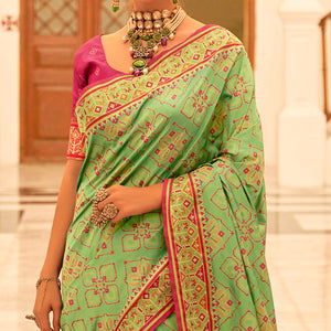 green-patola-printed-banarasi-silk-saree-with-tassels