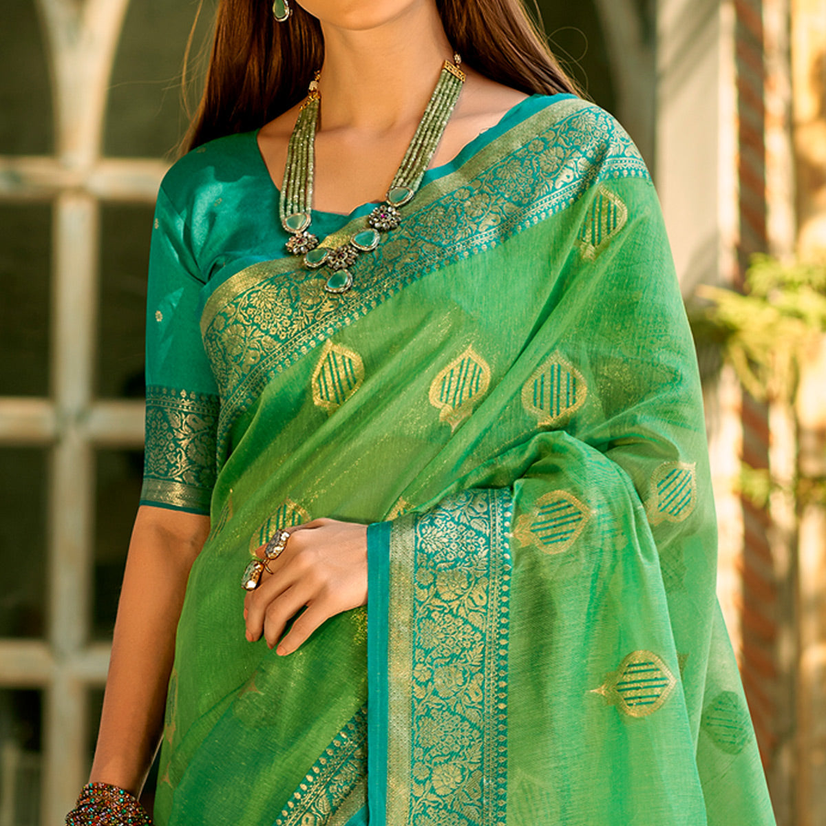green-floral-woven-tissue-silk-saree-with-tassels-1