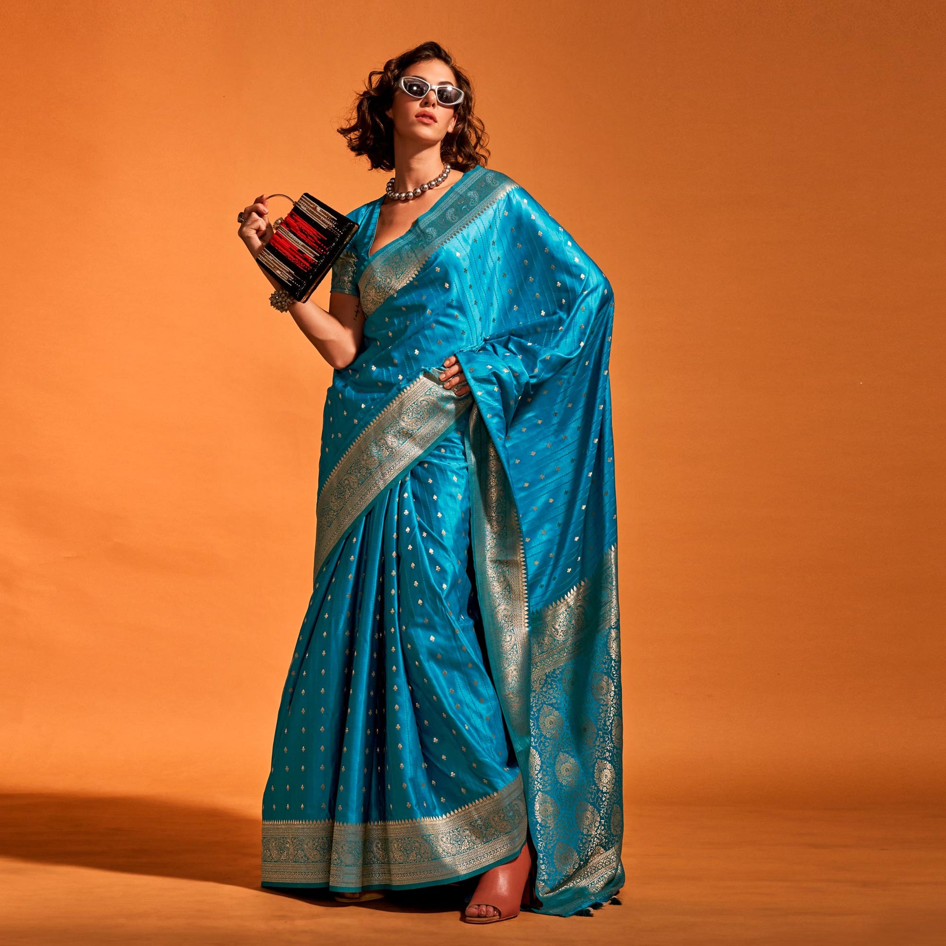 Blue Woven Zari Border Satin Saree With Tassels