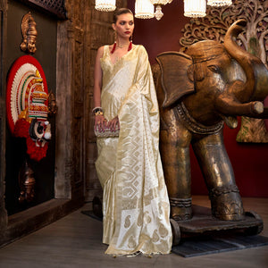 Cream Woven Satin Saree With Tassels