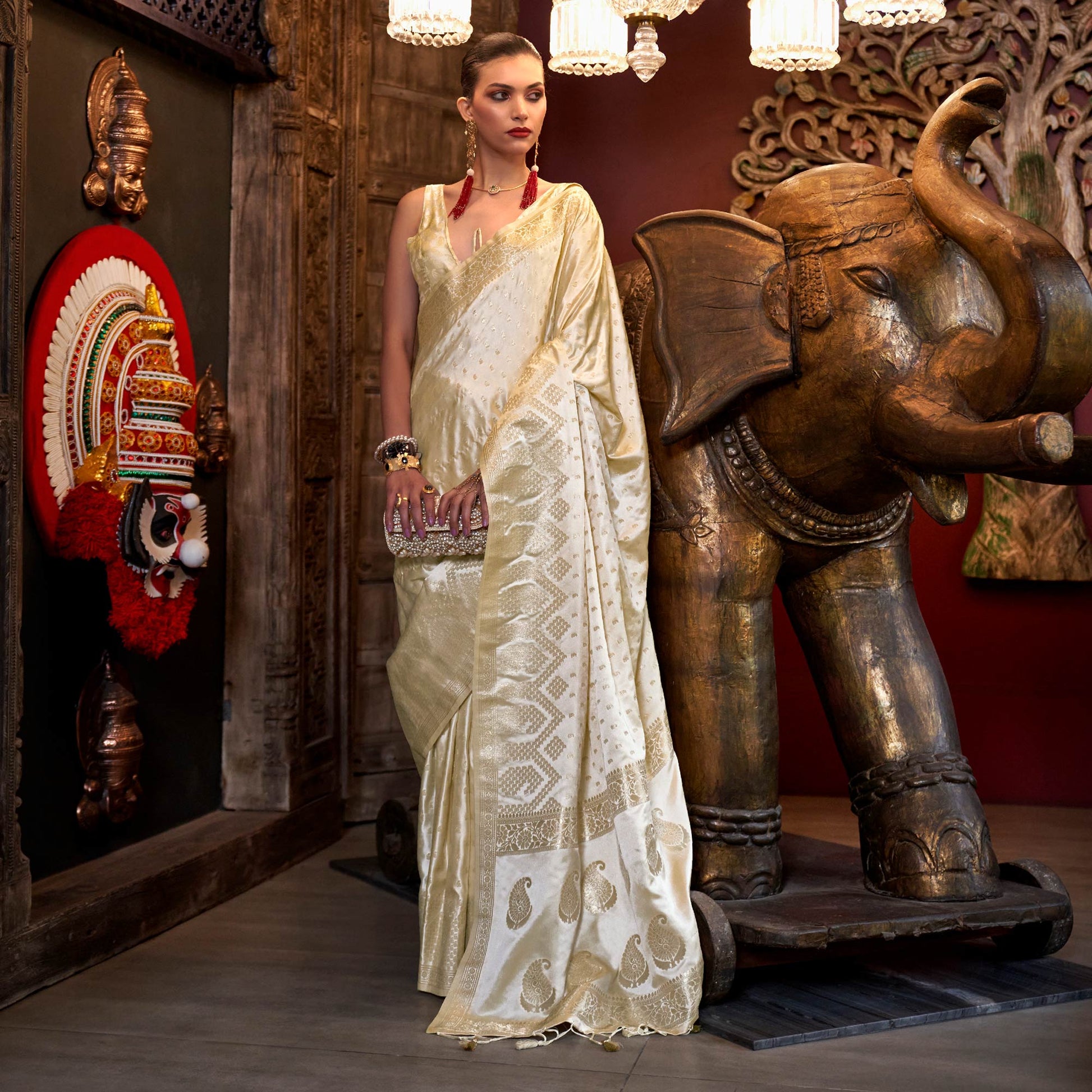 Cream Woven Satin Saree With Tassels