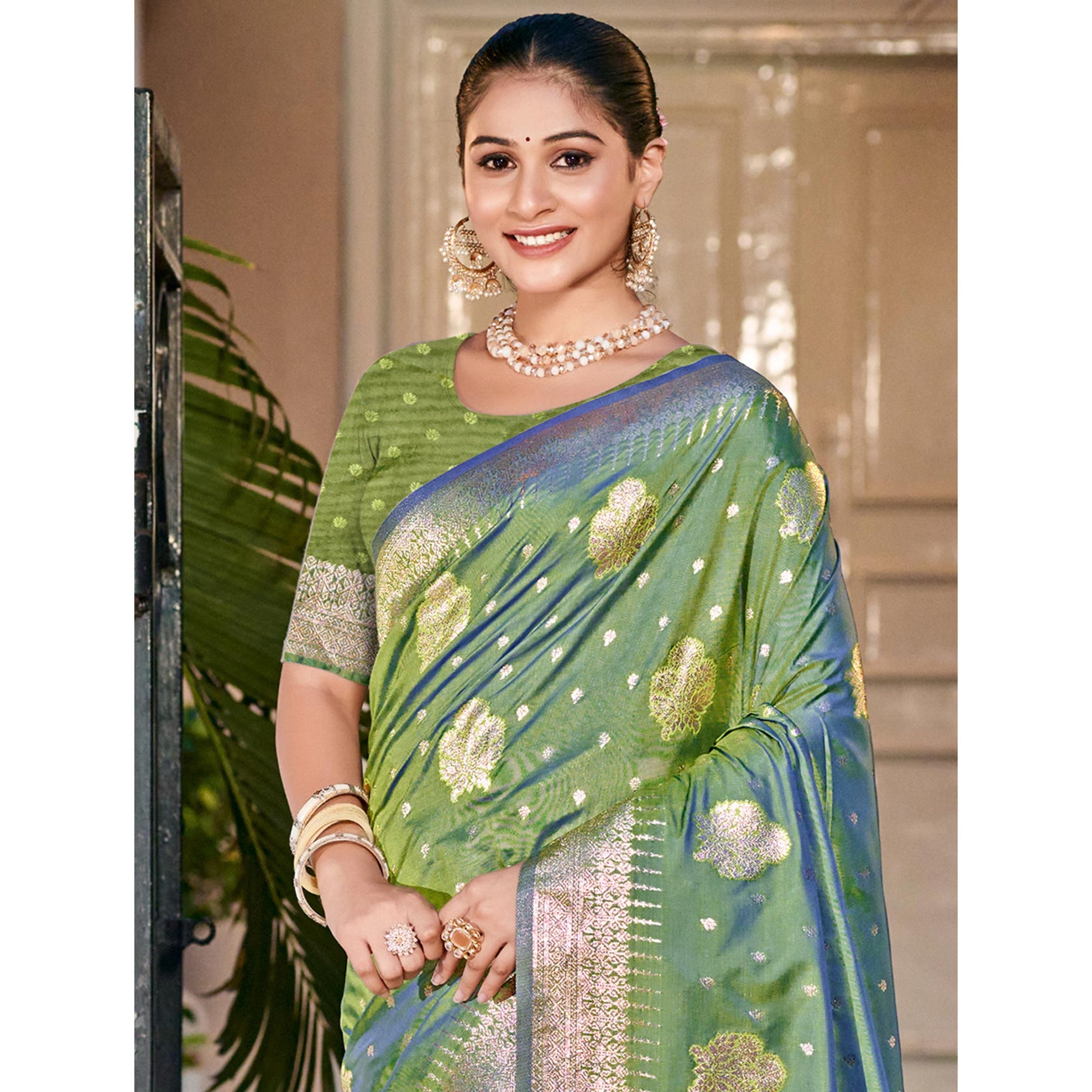 green-floral-woven-banarasi-silk-saree-with-tassels-12