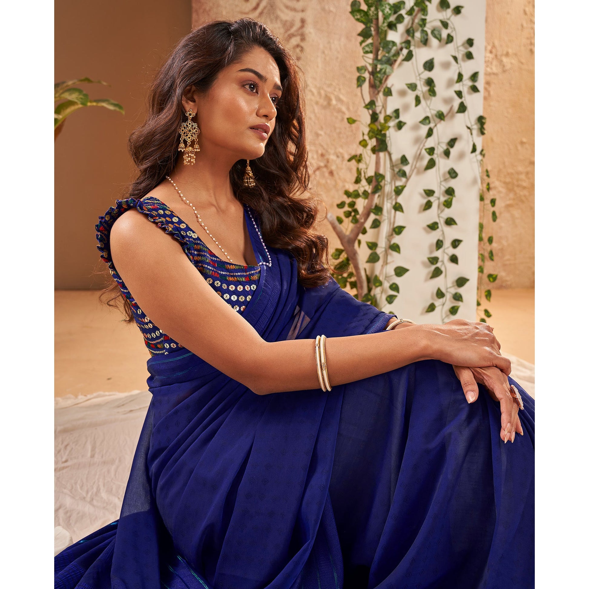 Blue Woven Georgette Saree With Tassels