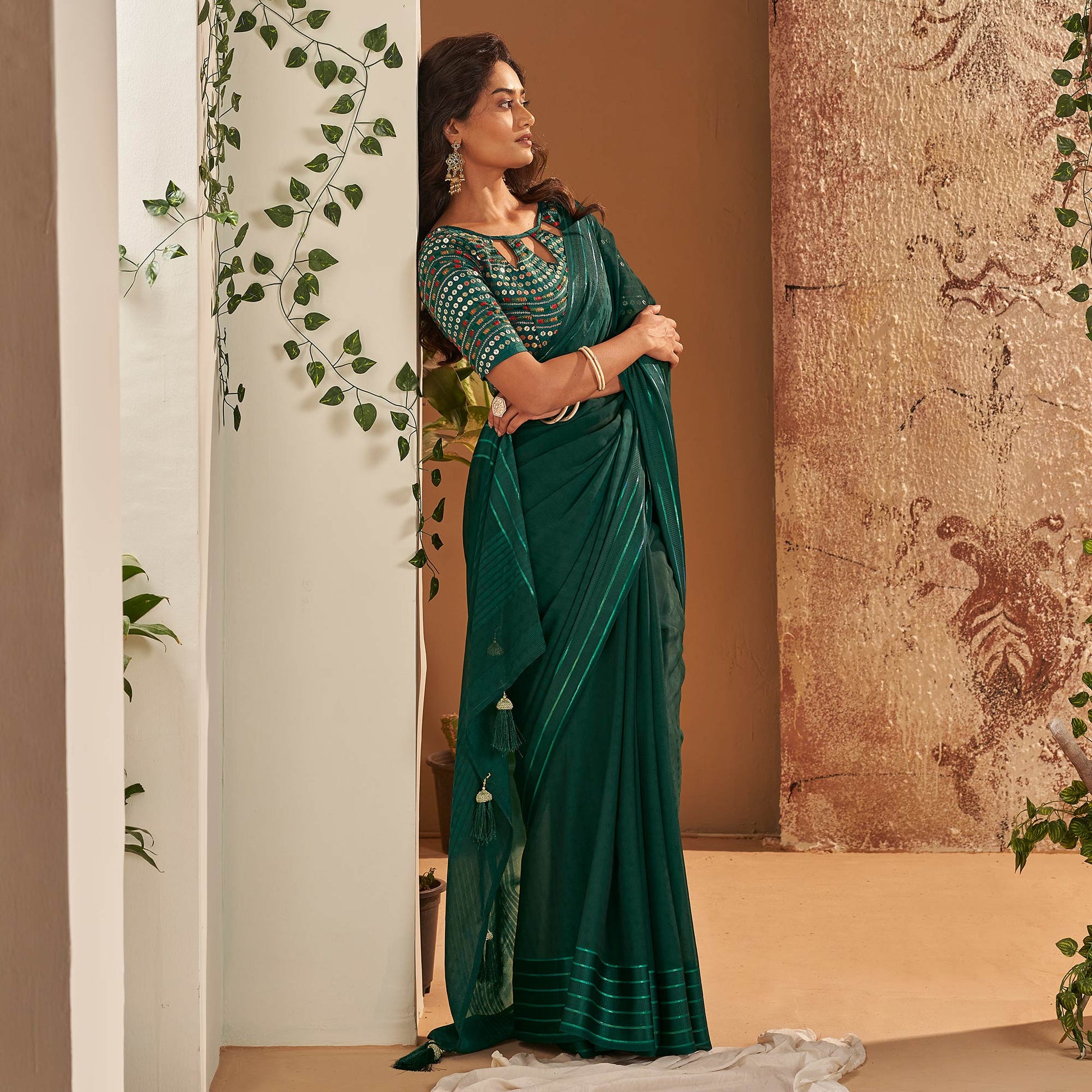 Dark Green Woven Georgette Saree With Tassels