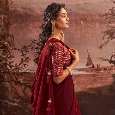 Dark Maroon Woven Georgette Saree With Tassels