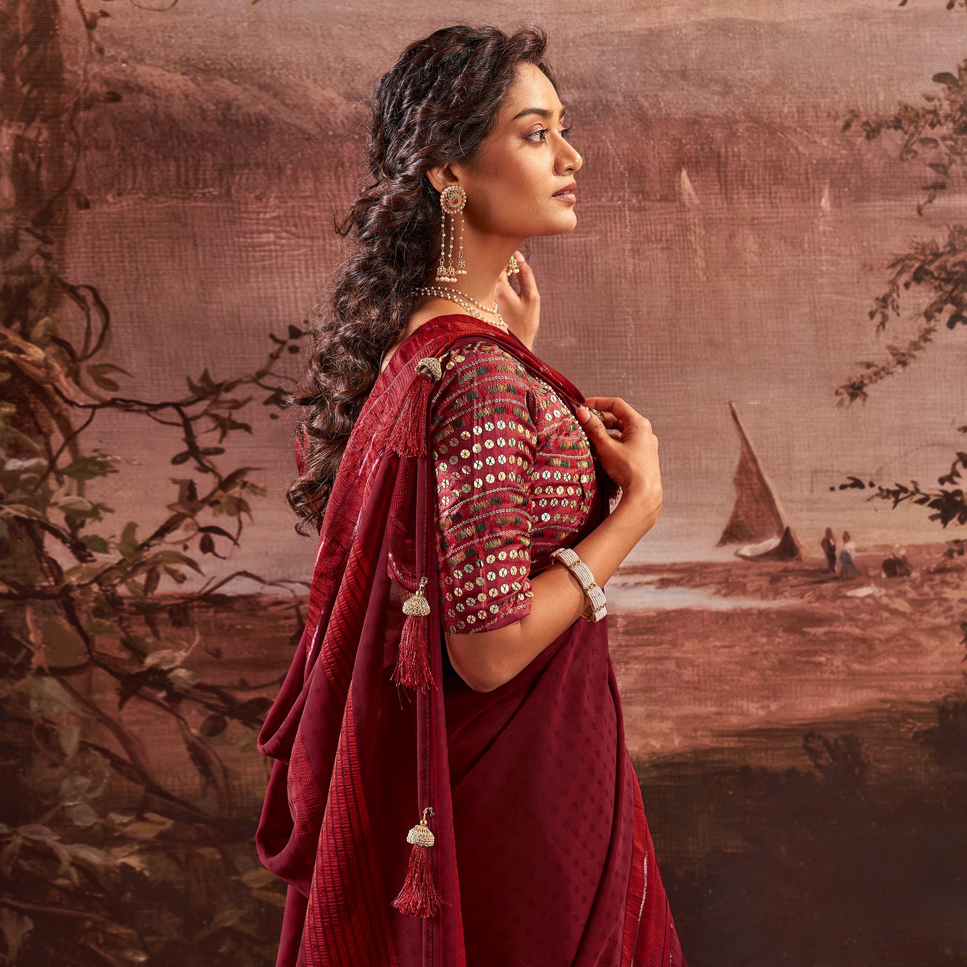 Maroon Woven Georgette Saree With Tassels