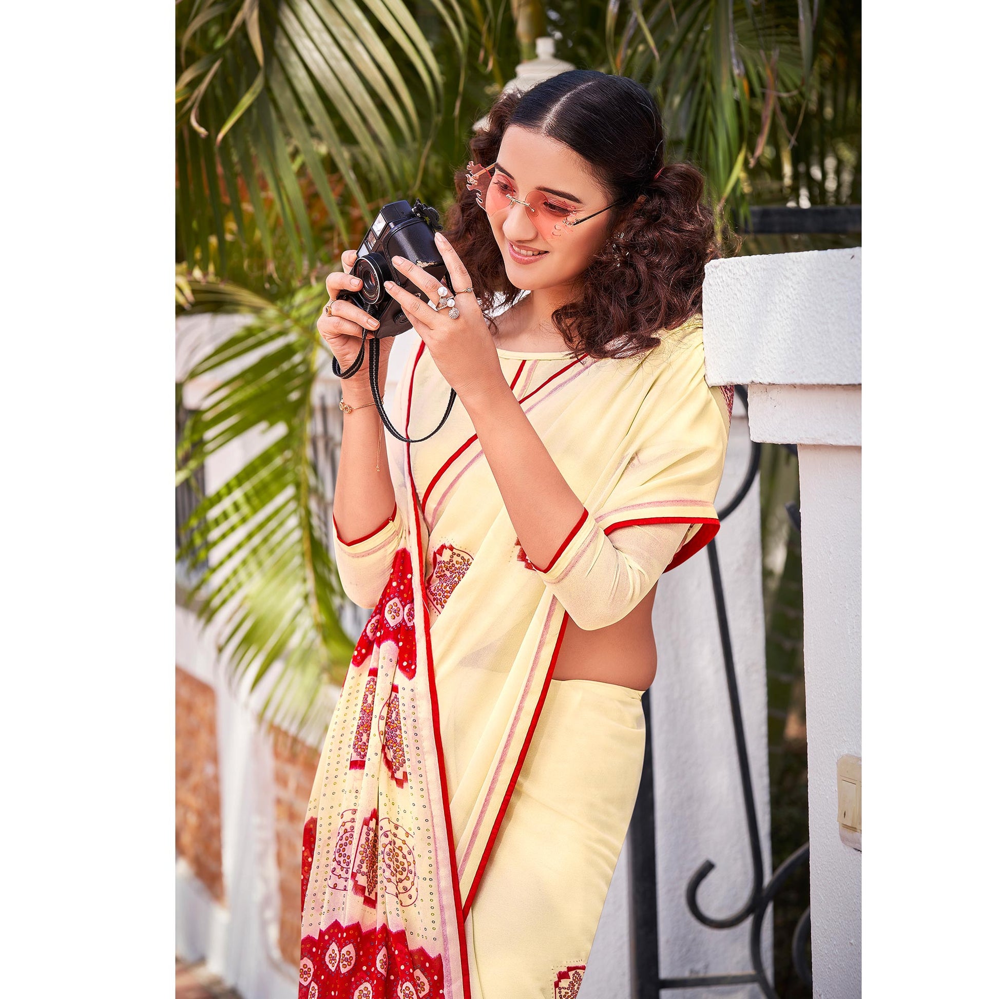 Cream Foil Printed Georgette Saree With Tassels