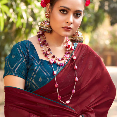 Maroon Woven Georgette Saree With Tassels