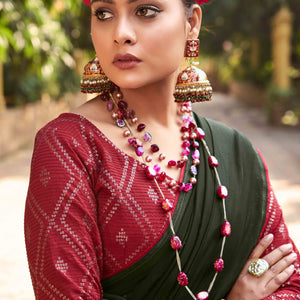 Bottle Green Woven Georgette Saree With Tassels
