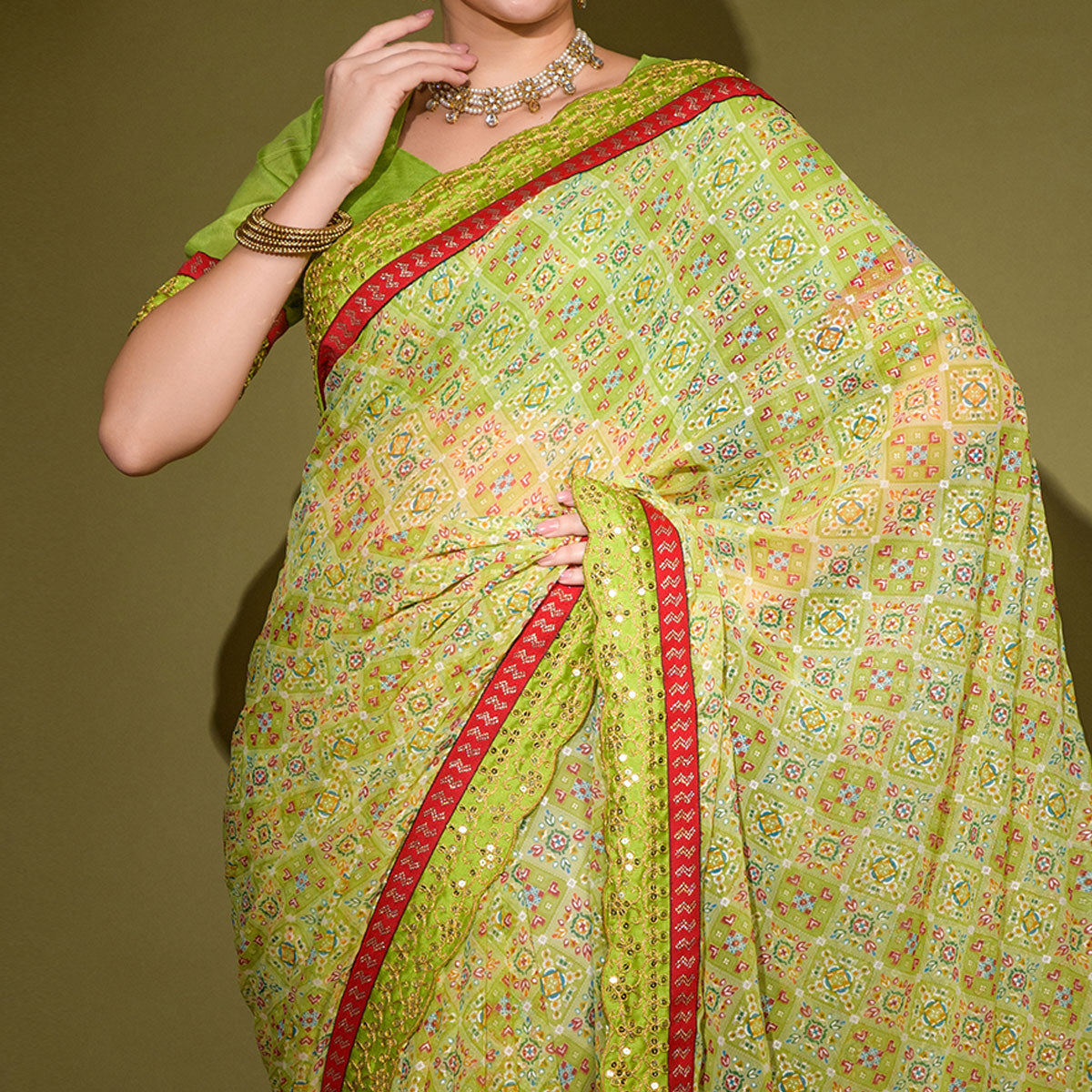 green-patola-foil-printed-georgette-saree-with-embroidered-border