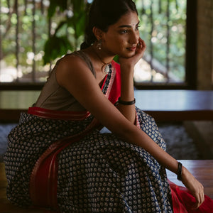 Indo Chanderi Cotton Saree with Screen-printed Floral Motifs in a striking red border