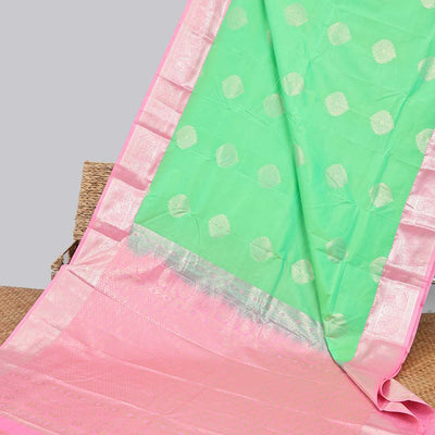 Green floral motifs gift saree with contrast paisley border & intricate zari design pallu