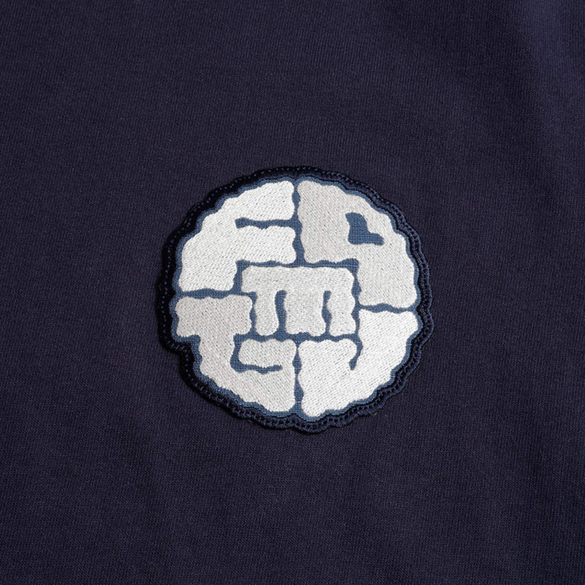 FDMTL | CIRCLE PATCH TEE { NAVY