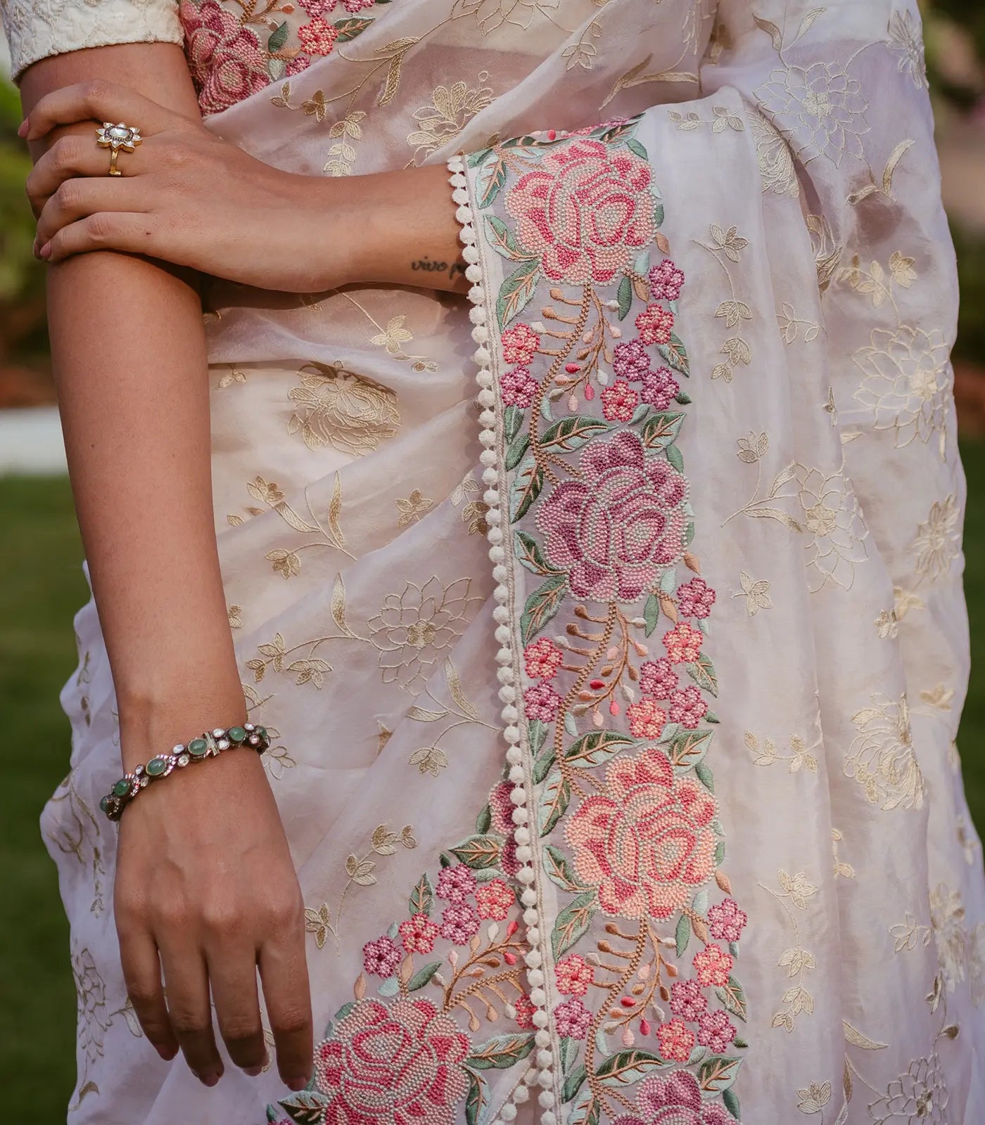 Cream Woven Organza Silk Saree With Embroidered Floral Motifs
