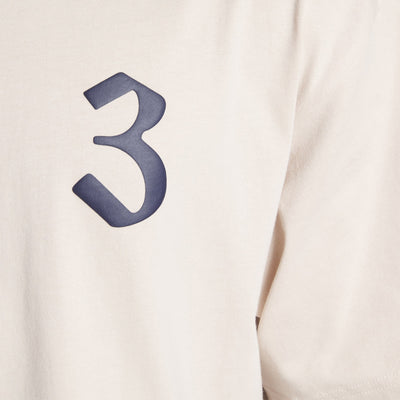 Reebok | LNY T-SHIRT  { SOFT ECRU