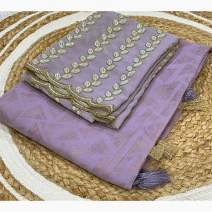 Lavender Geometric Foil Printed Georgette Saree With Tassels