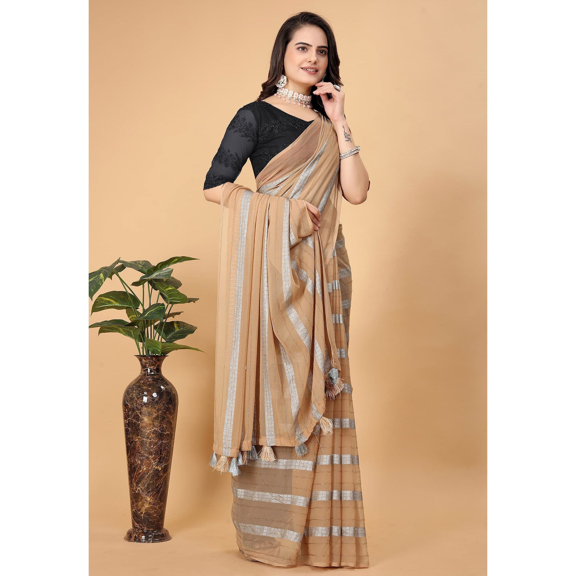 Chikoo Zari Striped Georgette Saree With Tassels