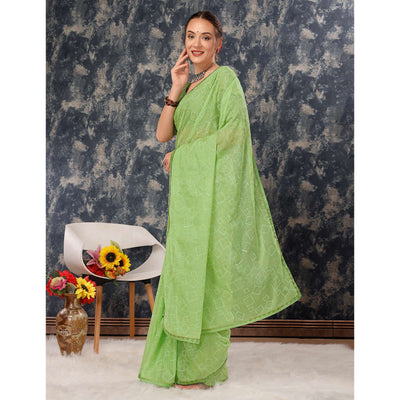 green-printed-with-zari-work-chiffon-saree-with-lace-border
