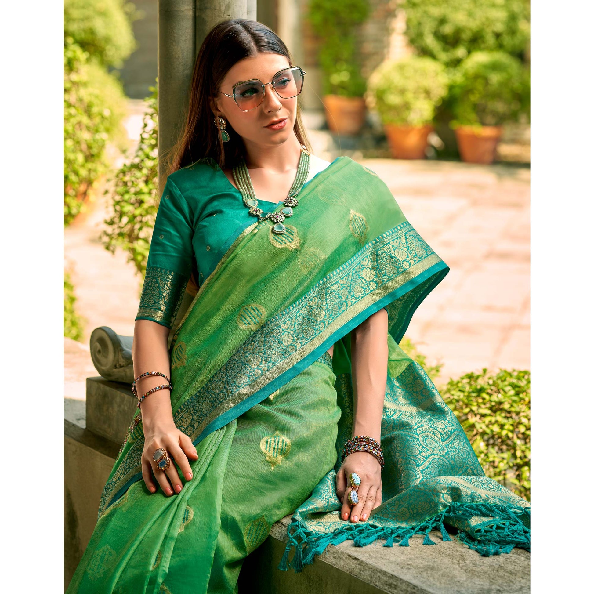 green-floral-woven-tissue-silk-saree-with-tassels-1