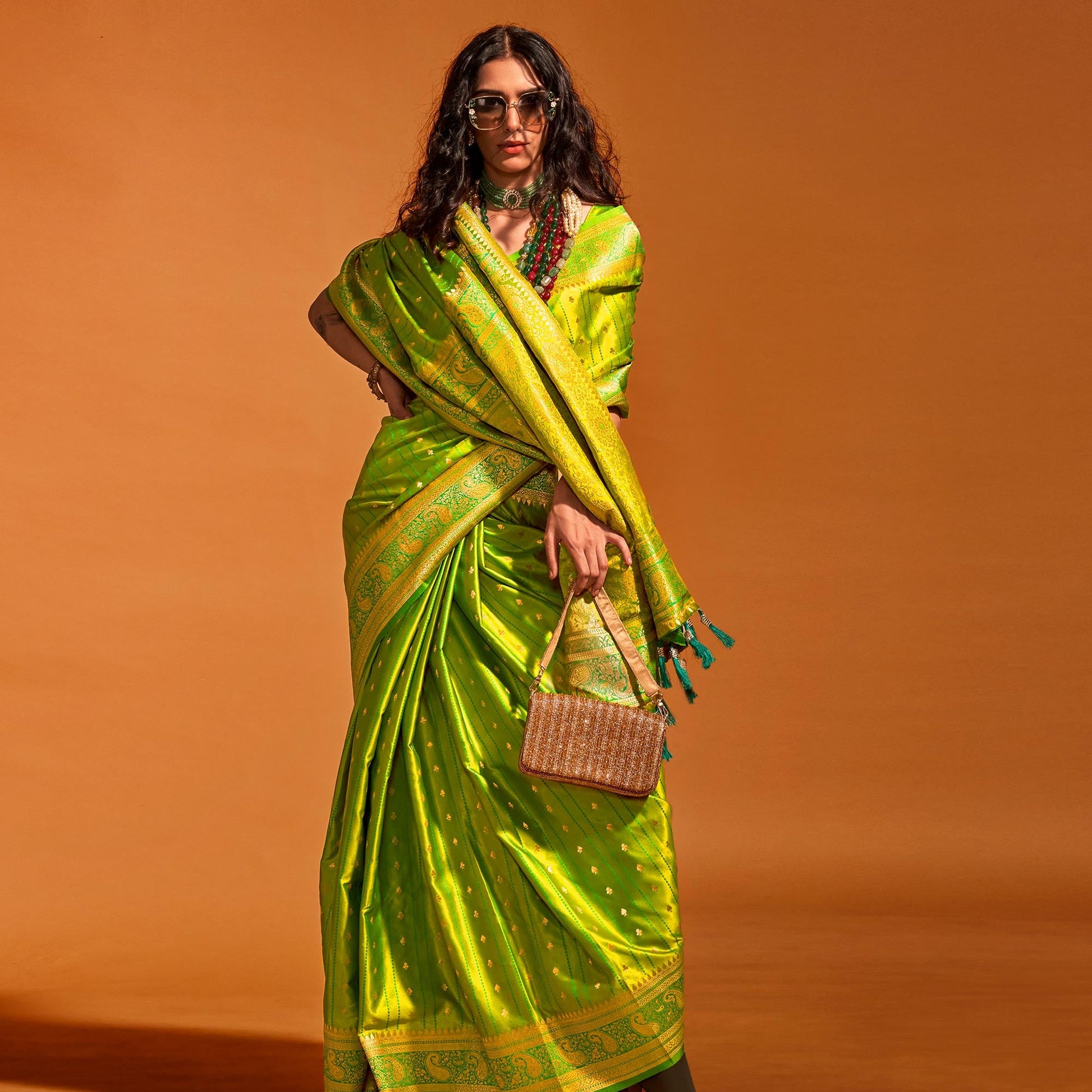 green-woven-zari-border-satin-saree-with-tassels