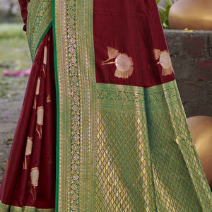 Maroon Floral Woven Banarasi Silk Saree With Tassels