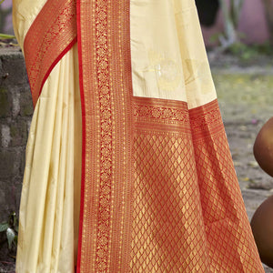 Cream Floral Woven Banarasi Silk Saree With Tassels