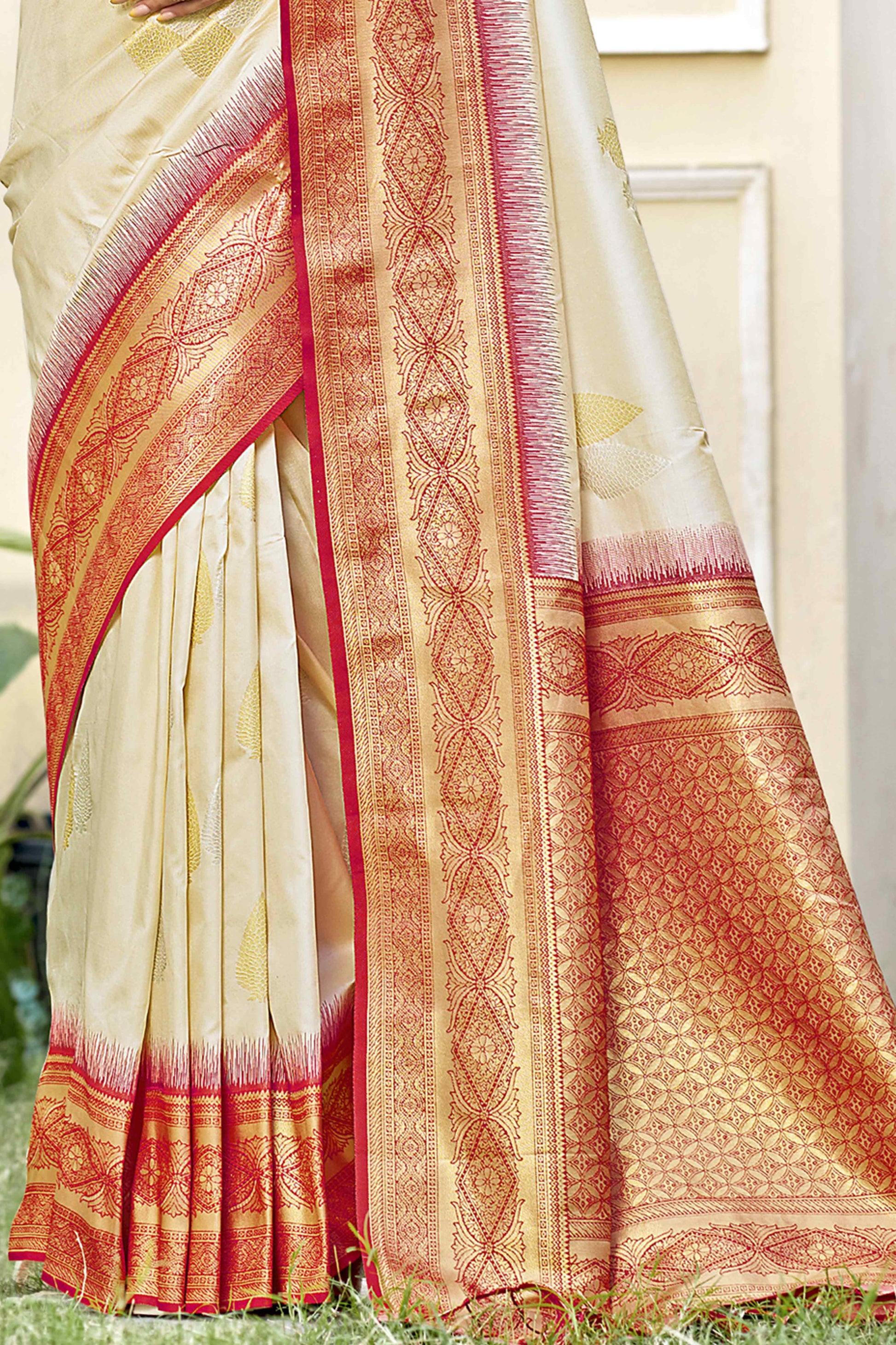 Cream Woven Banarasi Silk Saree With Tassels