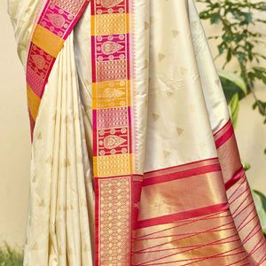 Cream Woven Banarasi Silk Saree With Tassels