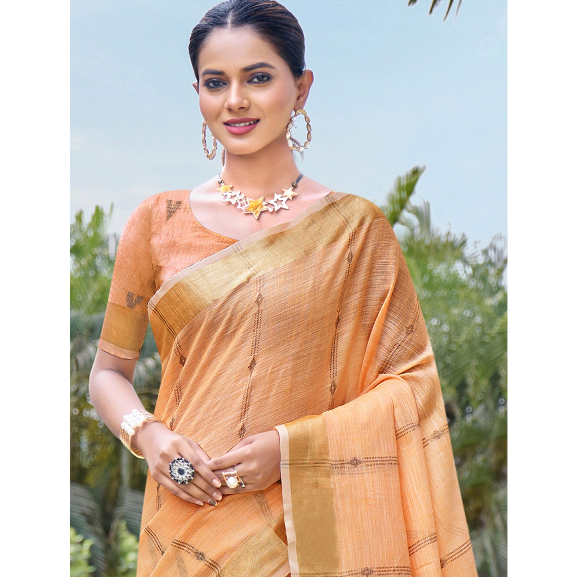 Light Orange Woven Cotton Blend Saree With Tassels