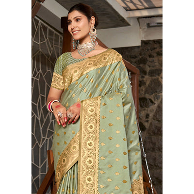 Light Green Woven Satin Silk Saree With Tassels