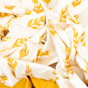 White Handloom Ikat Silk Saree With Contrast Mustard Border