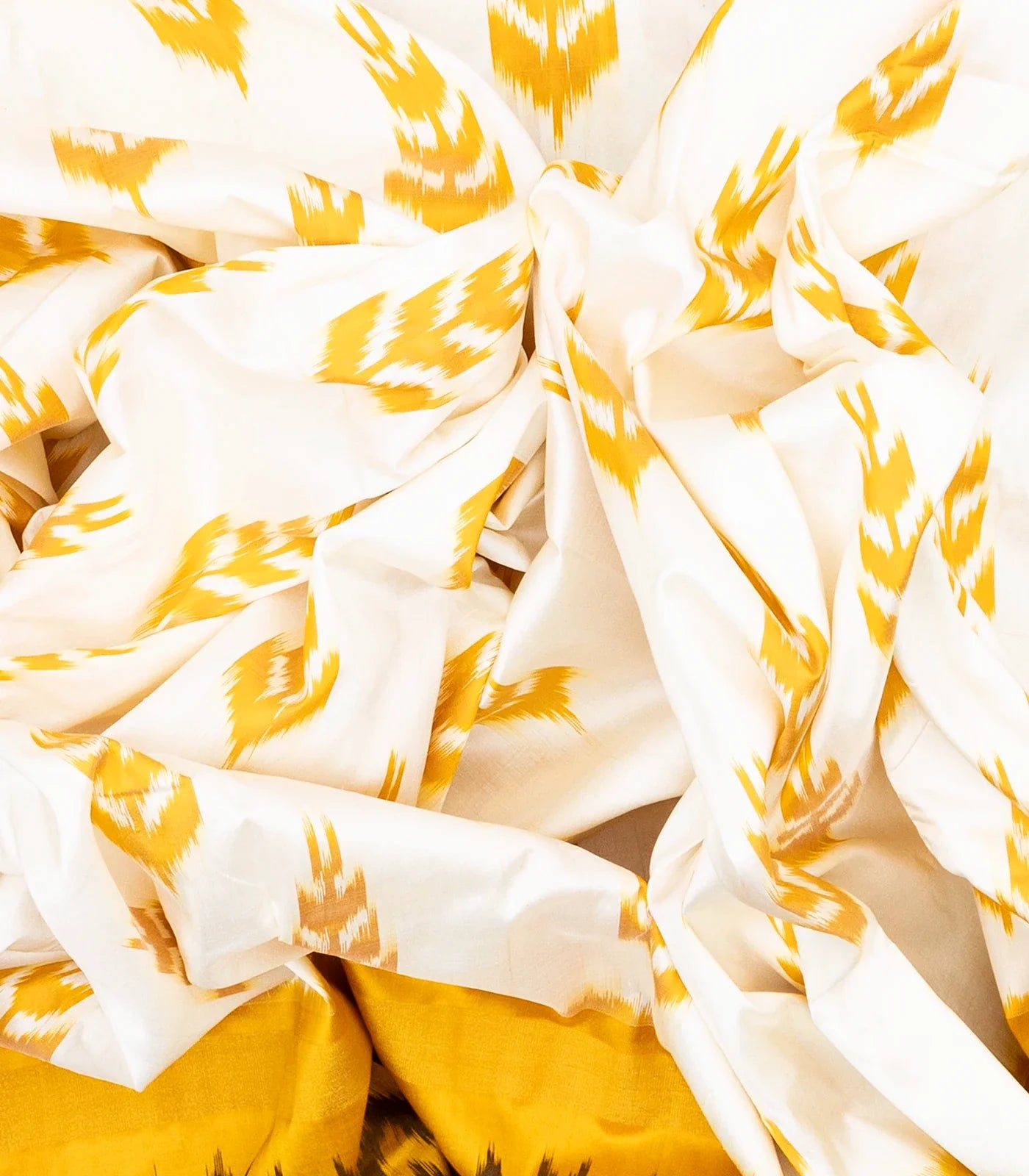 White Handloom Ikat Silk Saree With Contrast Mustard Border