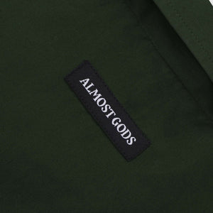 ALMOST GODS | ALPHA CROSS SPRAY PAINT SHIRT { GREEN