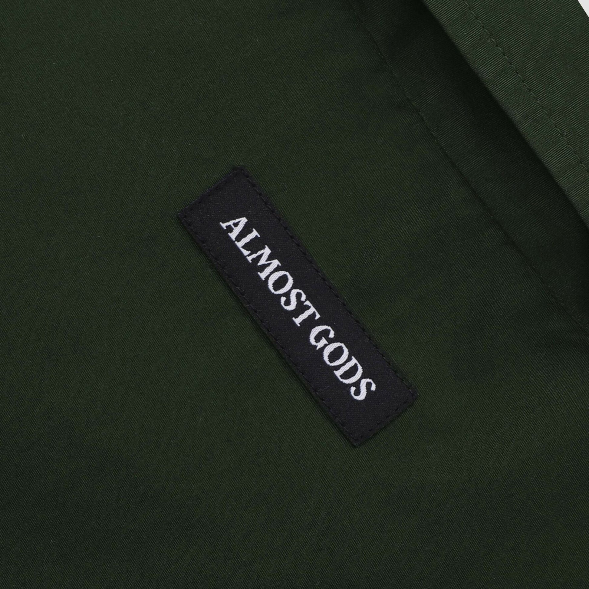 ALMOST GODS | ALPHA CROSS SPRAY PAINT SHIRT { GREEN