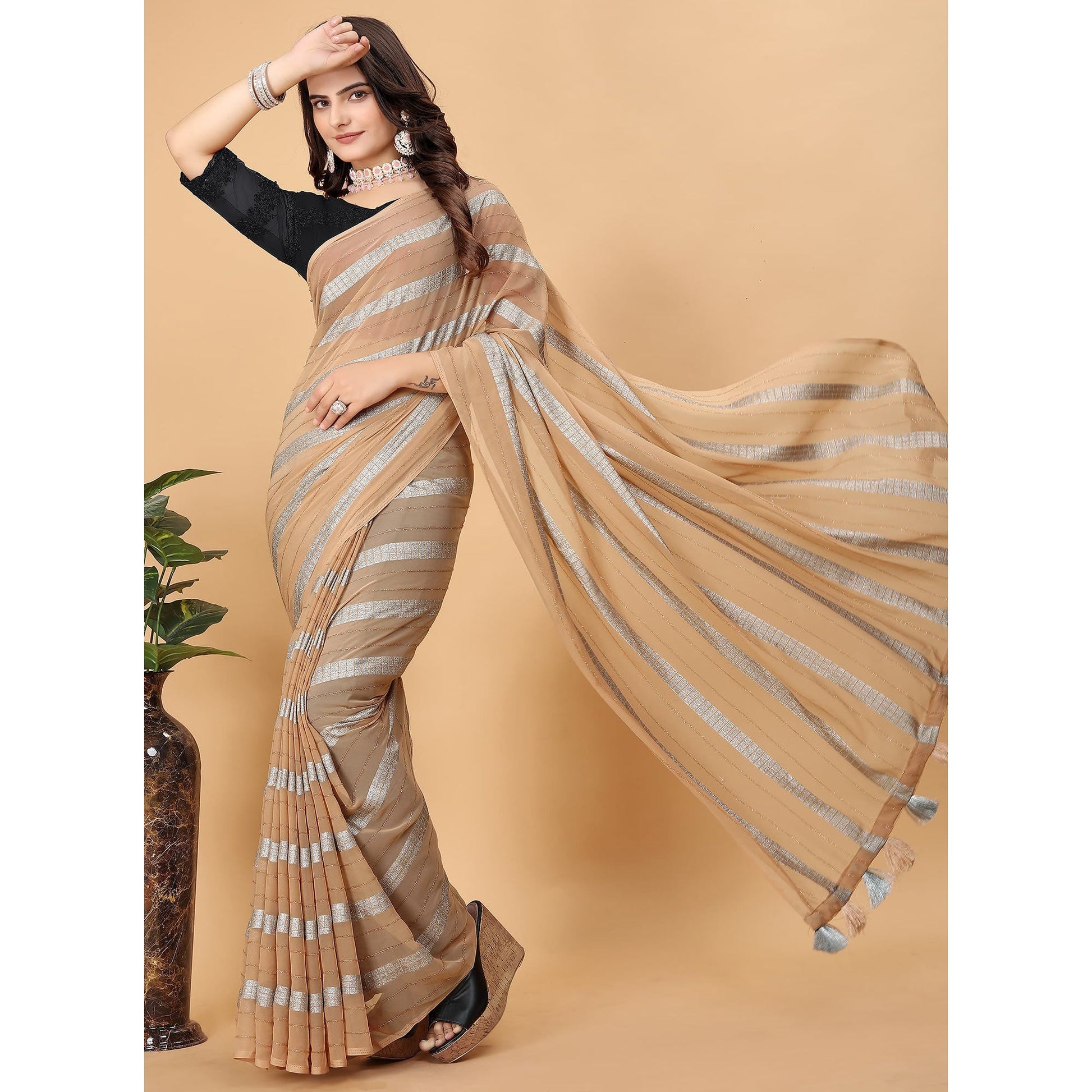 Chikoo Zari Striped Georgette Saree With Tassels