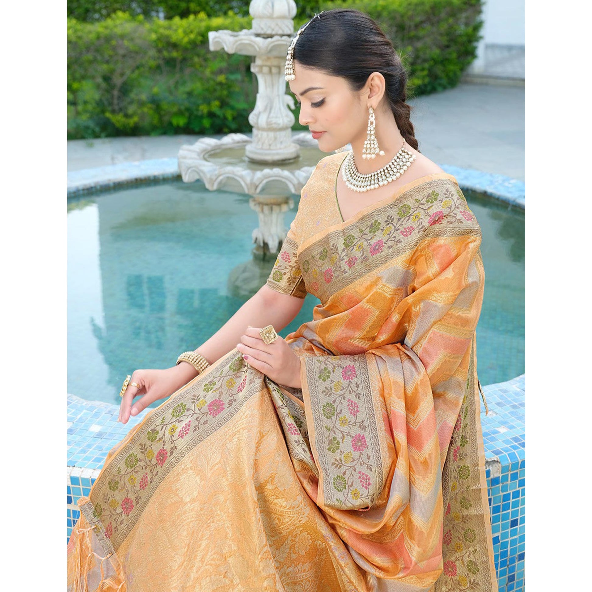 Light Orange Woven Organza Saree With Tassels