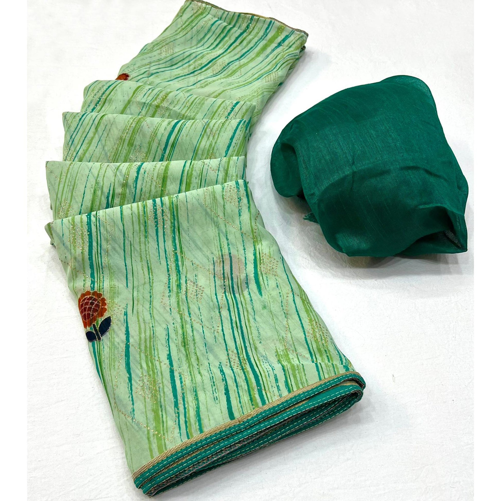 green-printed-raw-silk-saree-with-fancy-border