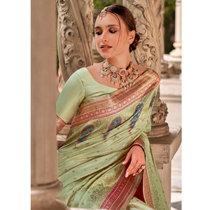 Chikoo Floral Woven Banarasi Silk Saree With Tassels