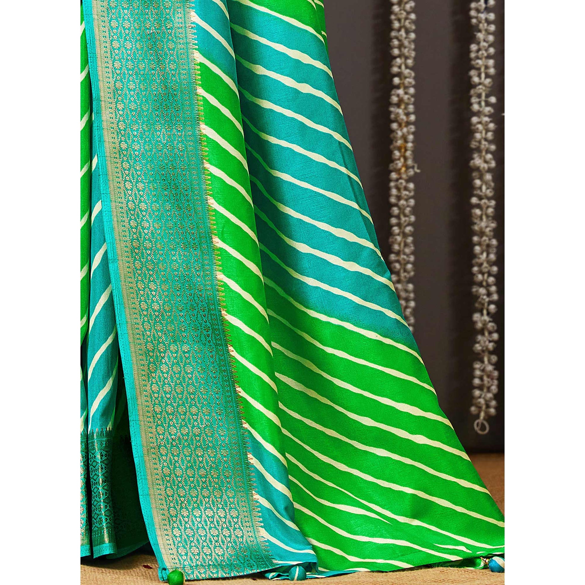 green-blue-printed-dola-silk-saree-with-zari-border