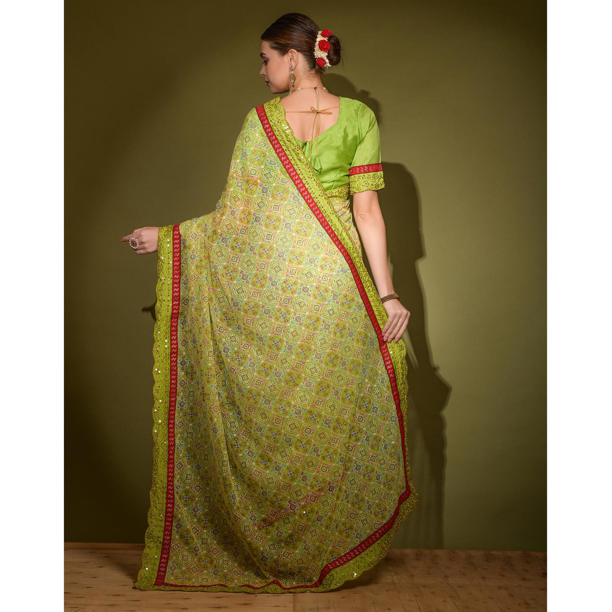 green-patola-foil-printed-georgette-saree-with-embroidered-border