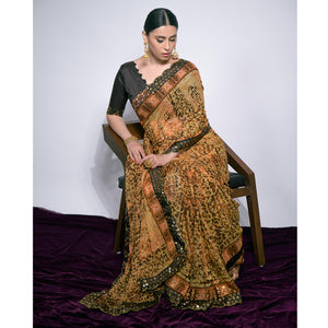 Brown Foil Printed Chiffon Saree With Embroidered Border