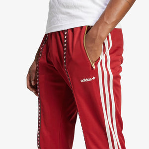 Adidas Originals | RETRO SPORTS CRICKET-INSPIRED TRACK PANTS { RUST RED