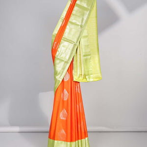 Orange floral motifs gift saree with contrast paisley border & intricate zari design pallu