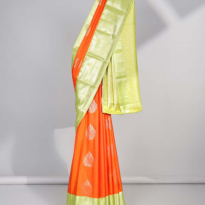 Orange floral motifs gift saree with contrast paisley border & intricate zari design pallu