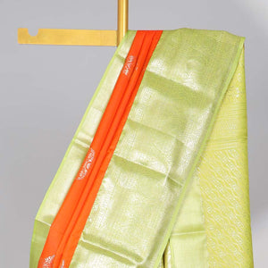 Orange floral motifs gift saree with contrast paisley border & intricate zari design pallu