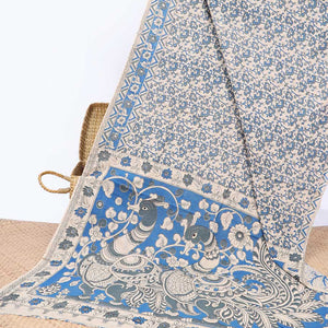 Blue floral machine-printed kalamkari cotton saree, floral border & peacock pallu